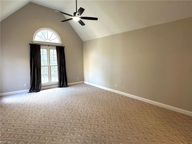 carpeted empty room featuring high vaulted ceiling and ceiling fan