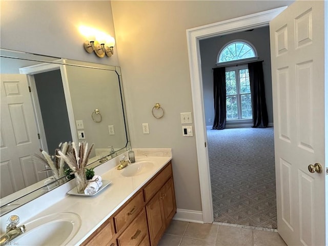 bathroom featuring tile patterned flooring and vanity