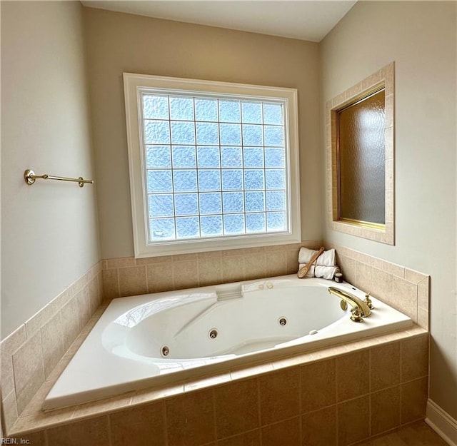 bathroom featuring tiled tub