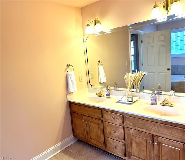 bathroom featuring a tub, tile patterned flooring, and vanity