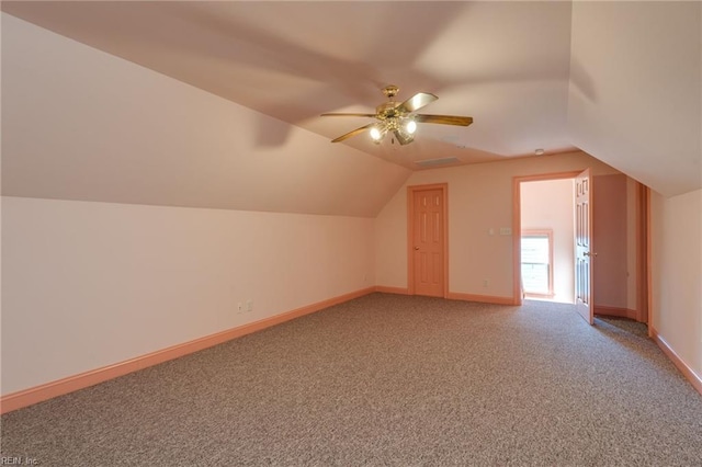 bonus room with ceiling fan, carpet floors, and vaulted ceiling