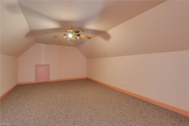 additional living space with carpet floors, ceiling fan, and lofted ceiling