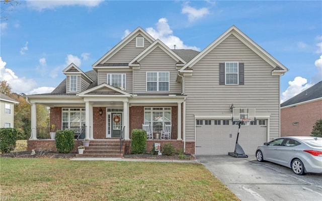 craftsman-style house with covered porch, a garage, and a front yard