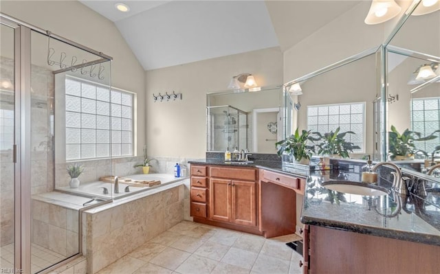 bathroom featuring tile patterned flooring, vanity, lofted ceiling, and shower with separate bathtub