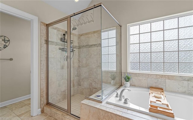 bathroom with tile patterned floors, plenty of natural light, and independent shower and bath