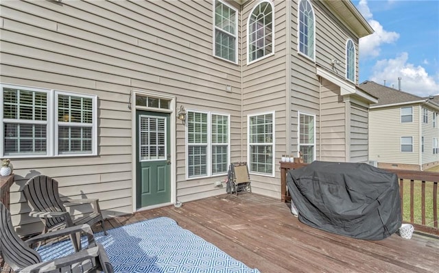 wooden deck with grilling area