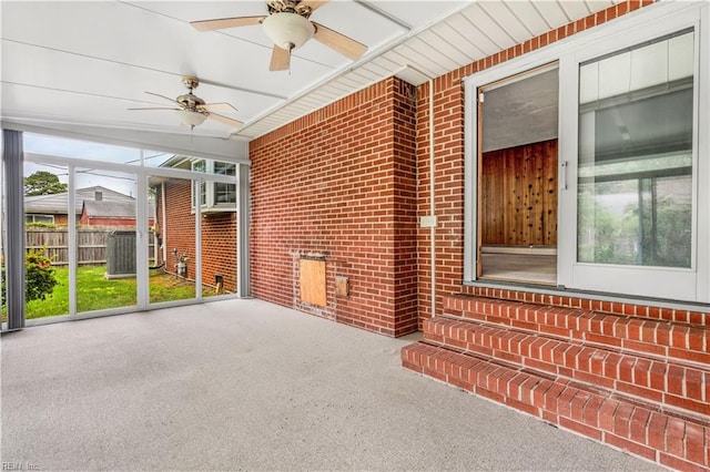 unfurnished sunroom with ceiling fan and a healthy amount of sunlight