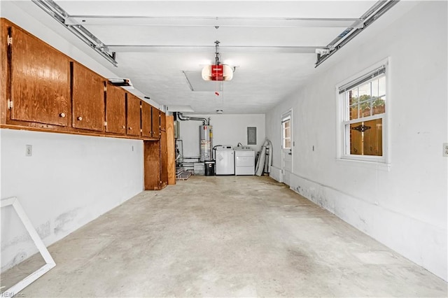 garage featuring a garage door opener, gas water heater, and independent washer and dryer