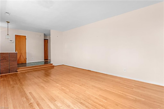 unfurnished living room featuring light hardwood / wood-style flooring