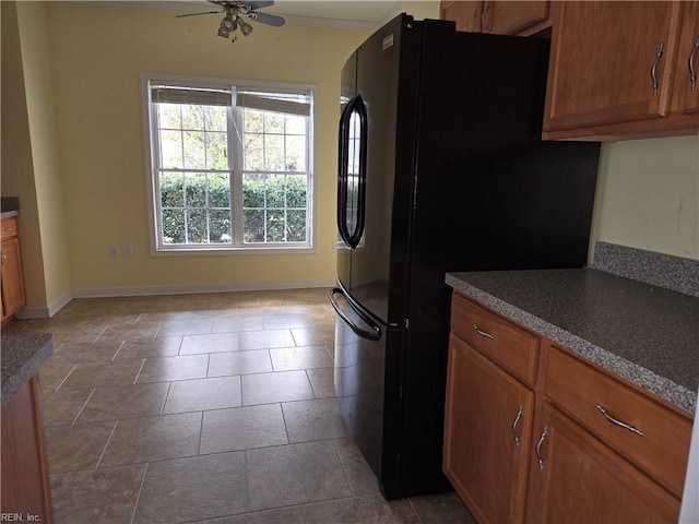 kitchen featuring black refrigerator and ceiling fan