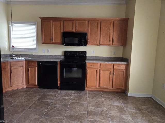 kitchen featuring sink, dark tile patterned floors, crown molding, and black appliances