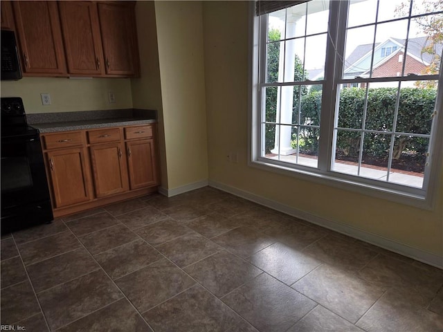 kitchen featuring a healthy amount of sunlight and black appliances