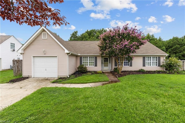 single story home with a garage and a front lawn