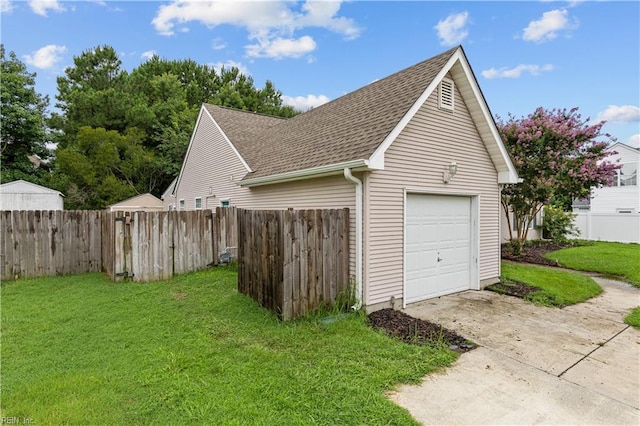 garage featuring a yard