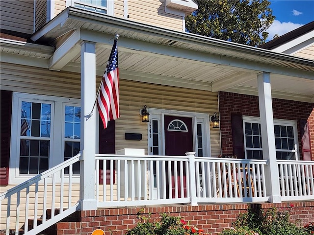 doorway to property featuring a porch