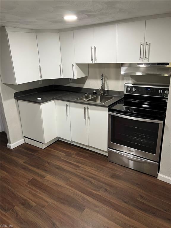 kitchen with stainless steel electric stove, dark hardwood / wood-style flooring, white cabinetry, and sink