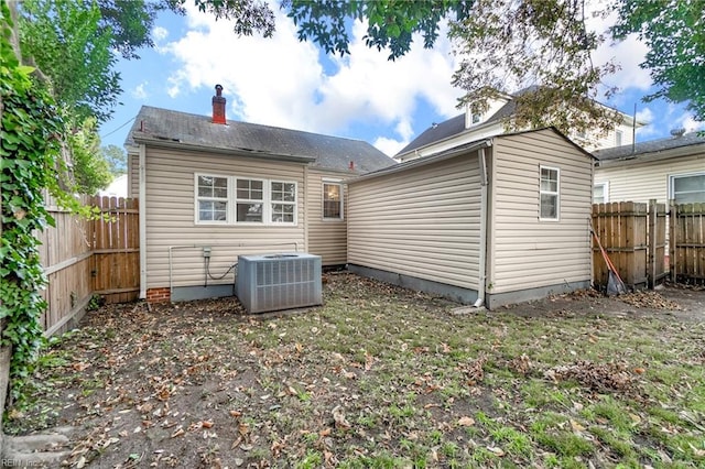 rear view of property featuring central air condition unit