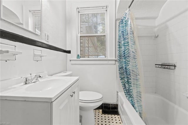 full bathroom with shower / bath combo with shower curtain, tile patterned flooring, vanity, and toilet