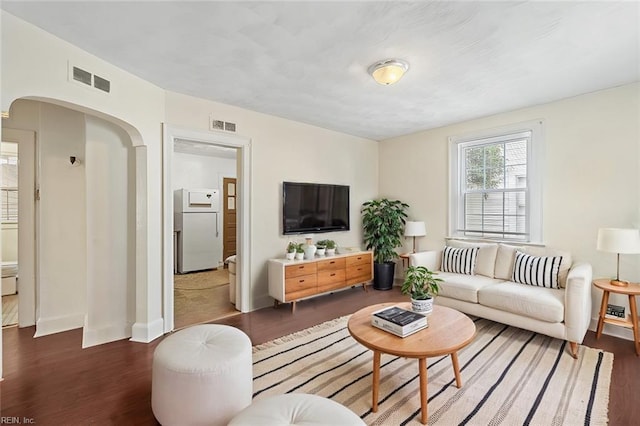 living room featuring dark hardwood / wood-style floors