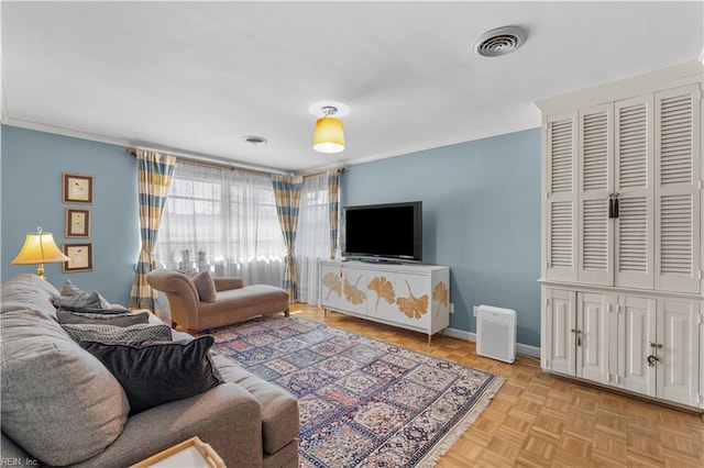 living room with ornamental molding and light parquet floors