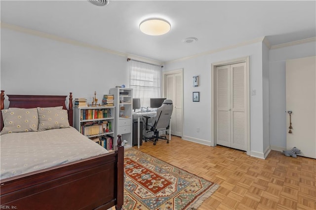 bedroom featuring two closets, light parquet floors, and crown molding