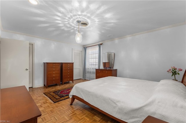 bedroom with ornamental molding and light parquet flooring