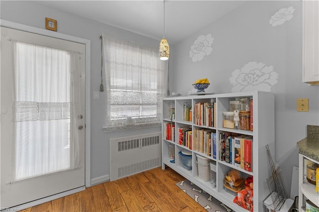 entryway featuring light hardwood / wood-style floors and radiator