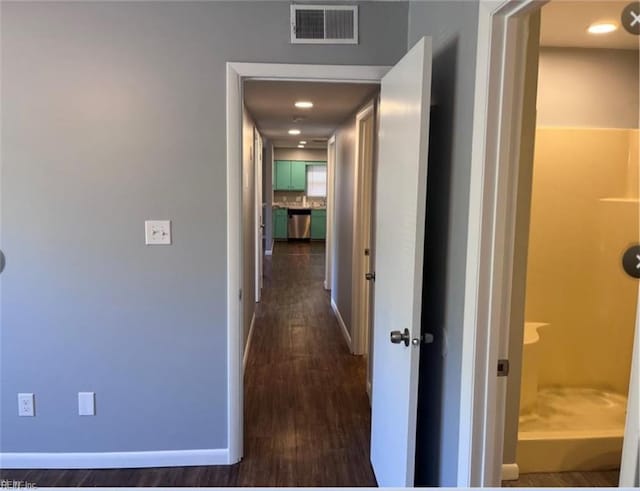 hall with dark hardwood / wood-style flooring