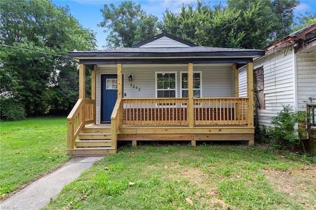 bungalow-style home featuring a front yard