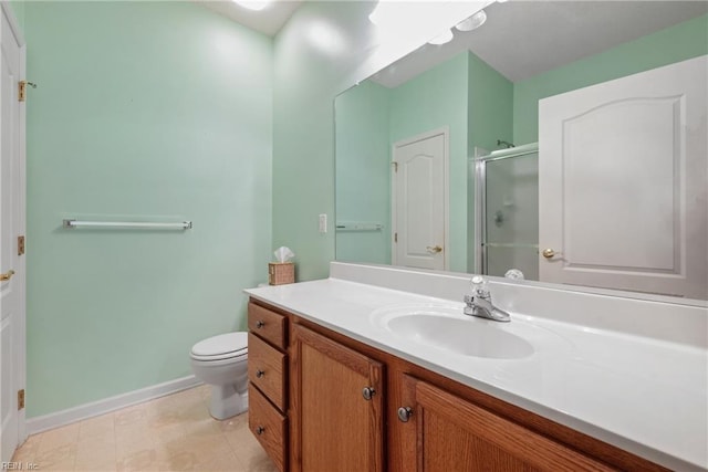 bathroom featuring tile patterned flooring, vanity, an enclosed shower, and toilet