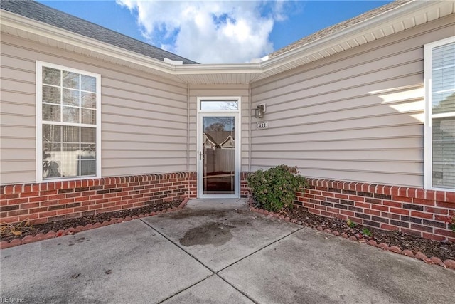 property entrance with a patio