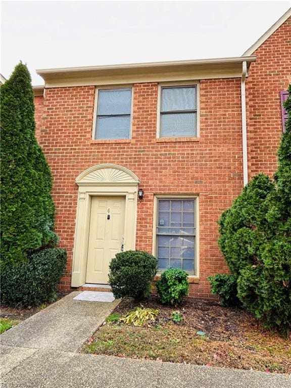 view of front of house with brick siding