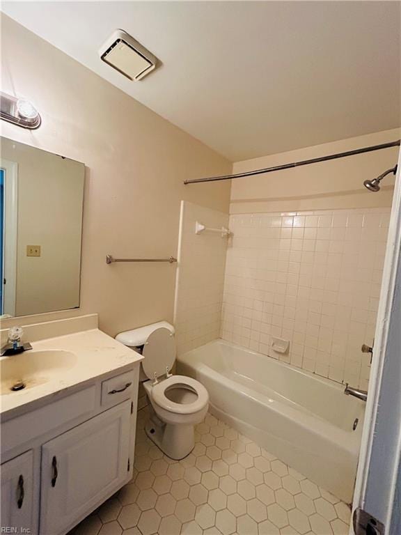 full bath with visible vents, vanity, toilet, and shower / bathtub combination