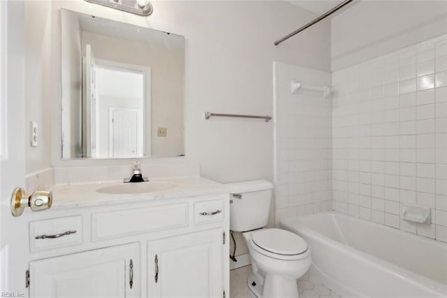 full bath featuring  shower combination, tile patterned flooring, vanity, and toilet