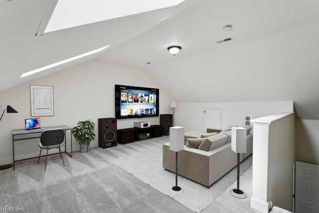 cinema featuring visible vents, vaulted ceiling, and light colored carpet