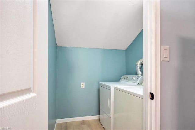 laundry room featuring independent washer and dryer and light wood-type flooring