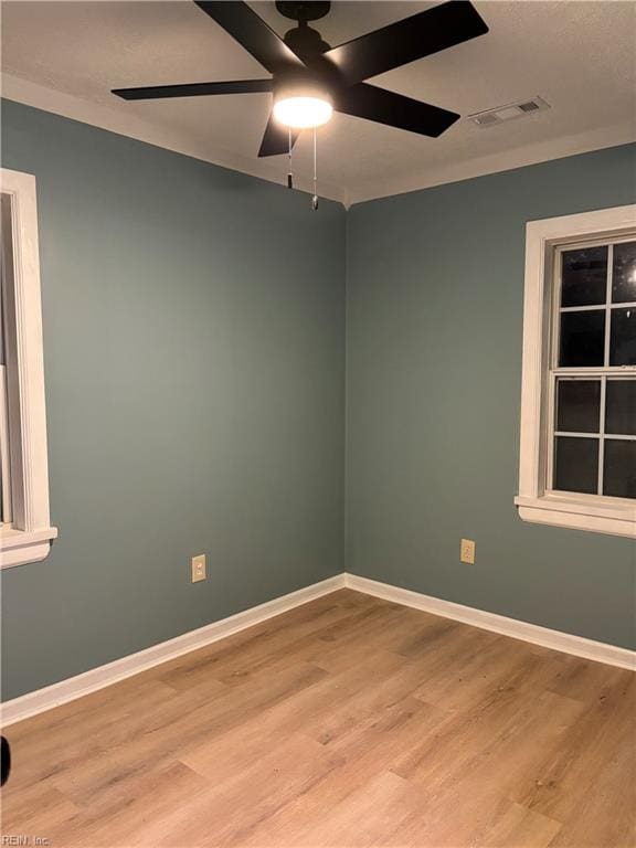 unfurnished room featuring light hardwood / wood-style floors and ceiling fan