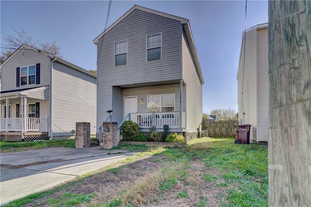 view of property featuring covered porch