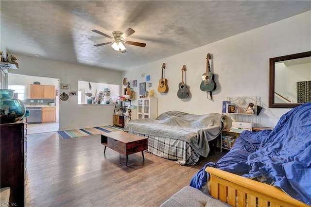 bedroom with light hardwood / wood-style flooring and ceiling fan