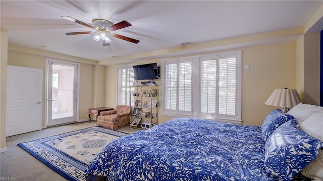 carpeted bedroom featuring ceiling fan