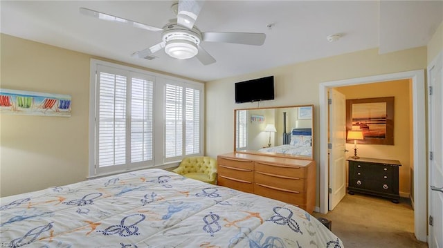 carpeted bedroom featuring ceiling fan