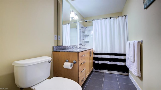 bathroom with tile patterned flooring, a shower with curtain, vanity, and toilet