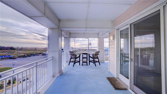 view of balcony at dusk