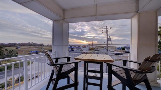 view of balcony at dusk