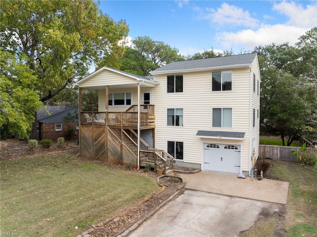 back of property featuring a lawn, a porch, and a garage