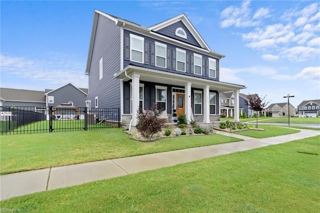 view of front facade featuring covered porch and a front yard