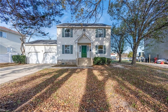 view of front of property featuring a front lawn and a garage