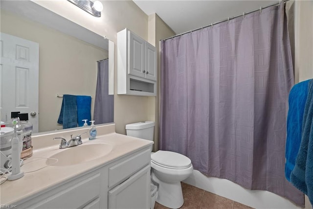 bathroom featuring tile patterned flooring, vanity, and toilet