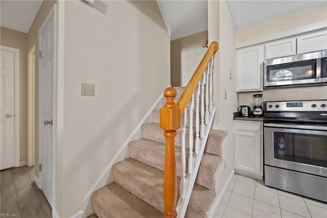 kitchen with white cabinets and stainless steel appliances