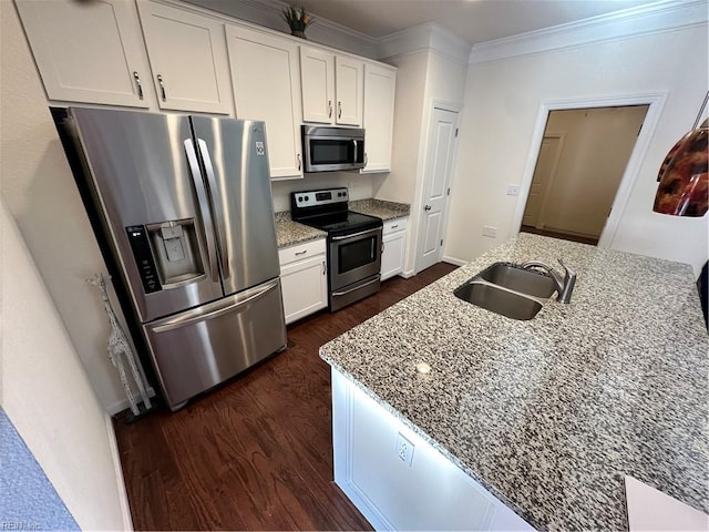 kitchen featuring white cabinetry, sink, stainless steel appliances, and light stone counters